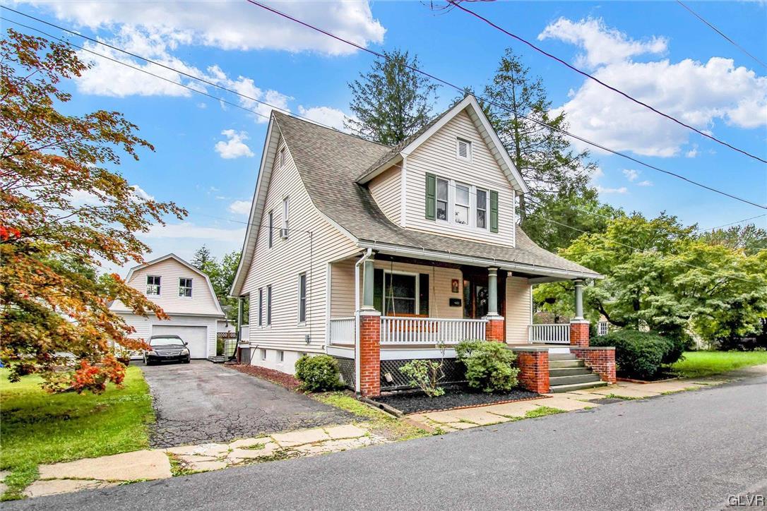 511 Brown Street Stroudsburg, PA 18360 - Photo 32 of 33 a front view of a house with a garden and garage