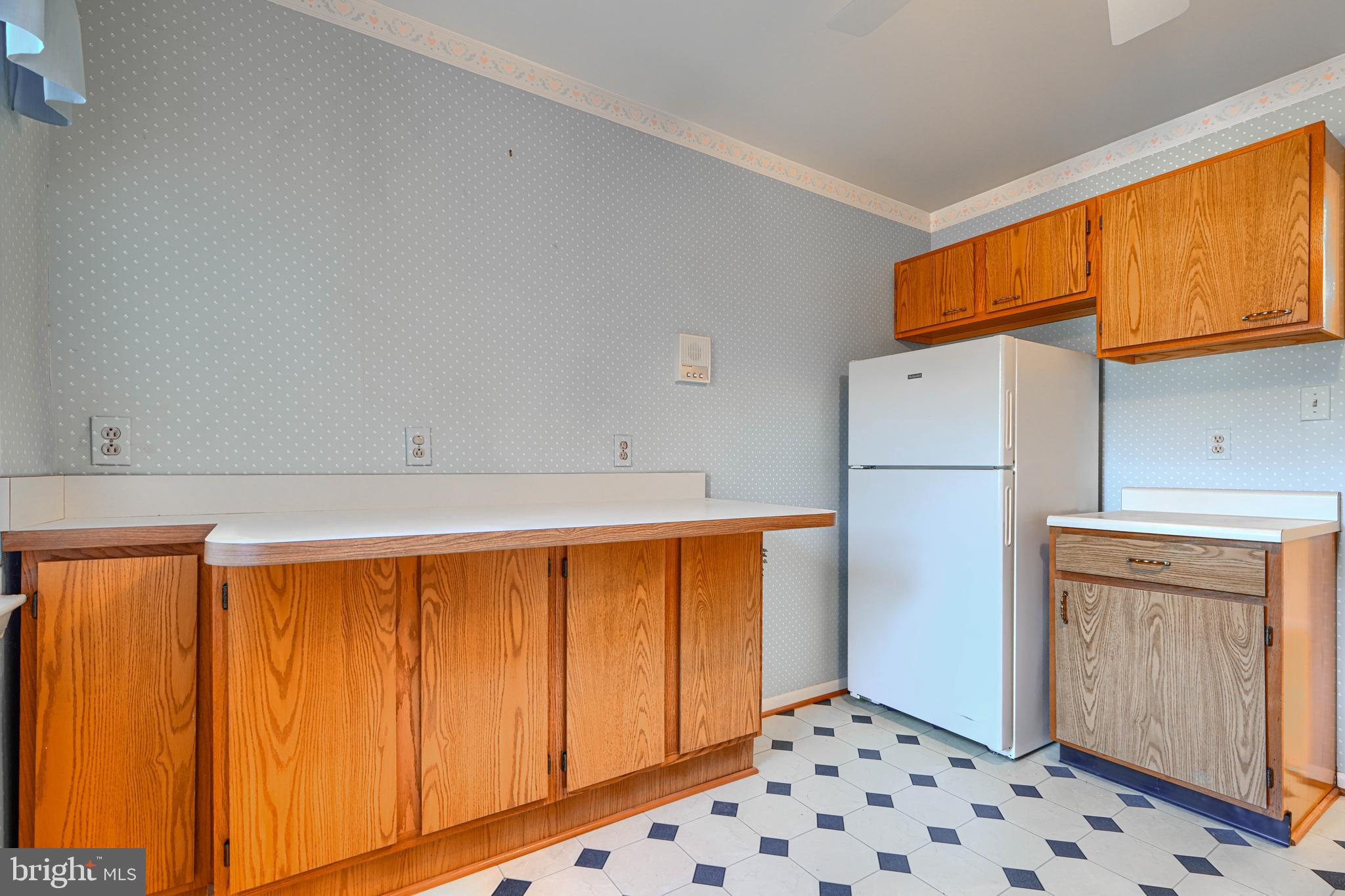 4 Juliet Lane, Unit 301 Baltimore, MD 21236 - Photo 12 of 29 a bathroom with a sink and a refrigerator