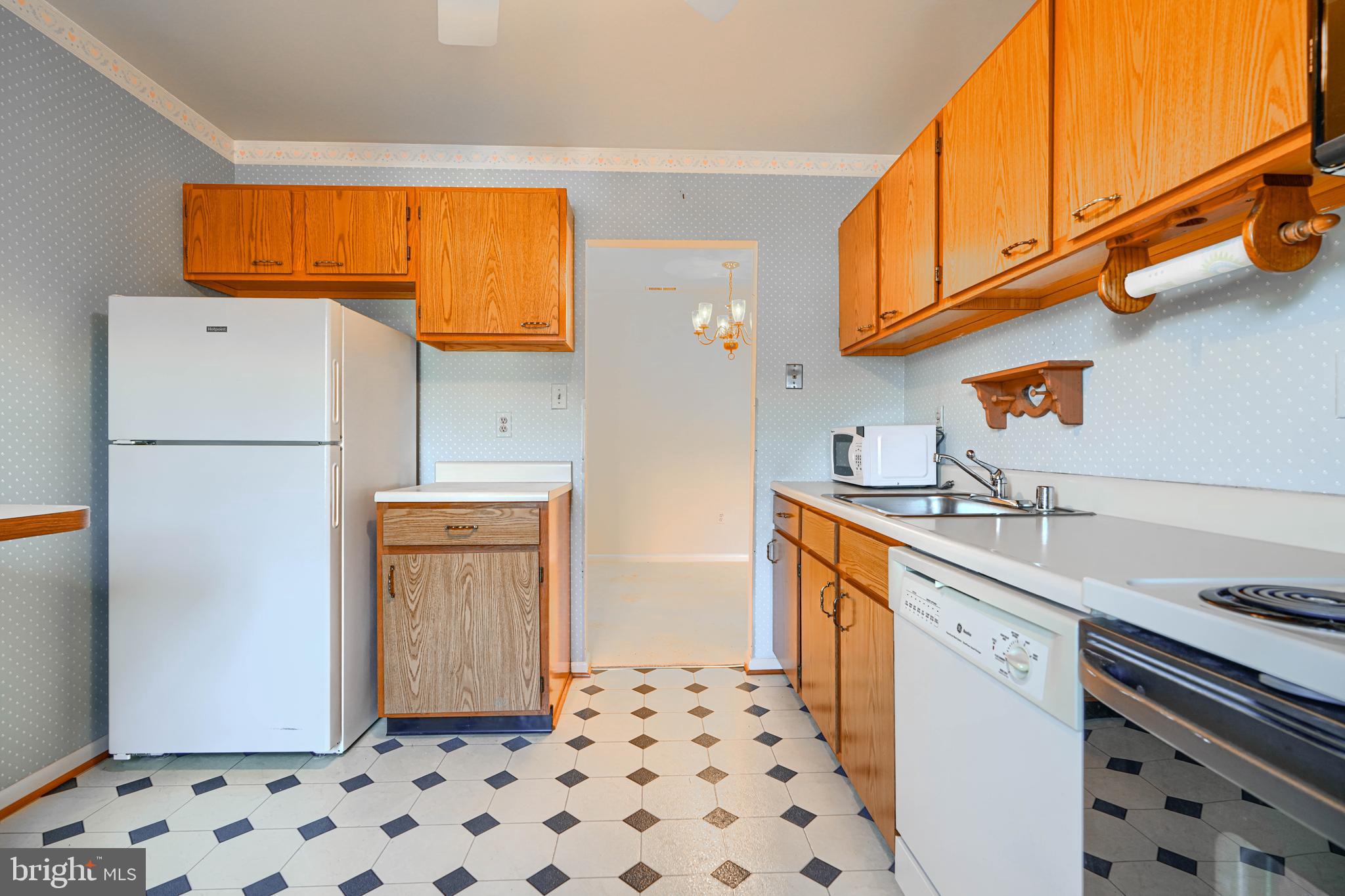 4 Juliet Lane, Unit 301 Baltimore, MD 21236 - Photo 14 of 29 a kitchen with stainless steel appliances a refrigerator and a stove