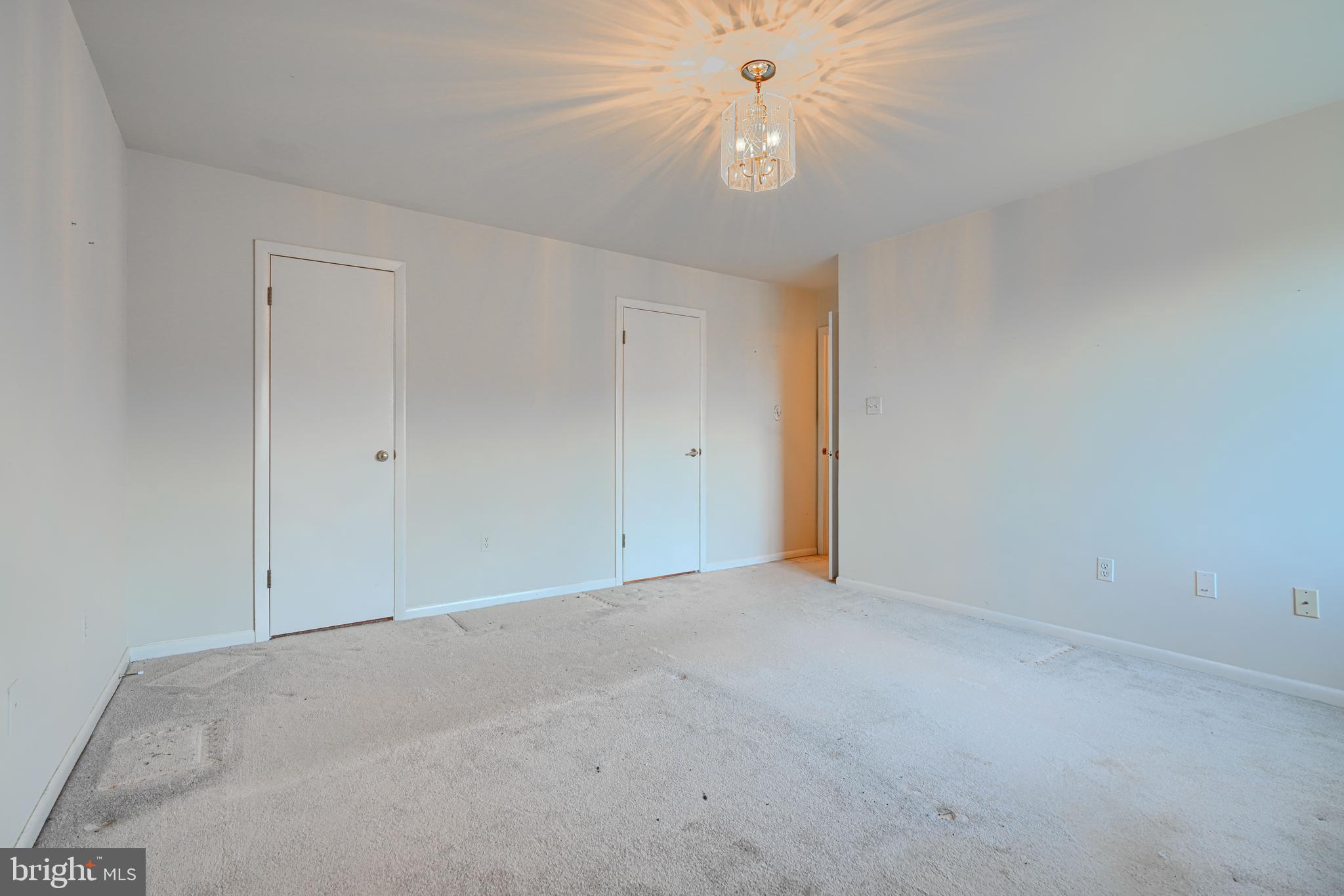 4 Juliet Lane, Unit 301 Baltimore, MD 21236 - Photo 16 of 29 an empty room with a fan and a ceiling fan