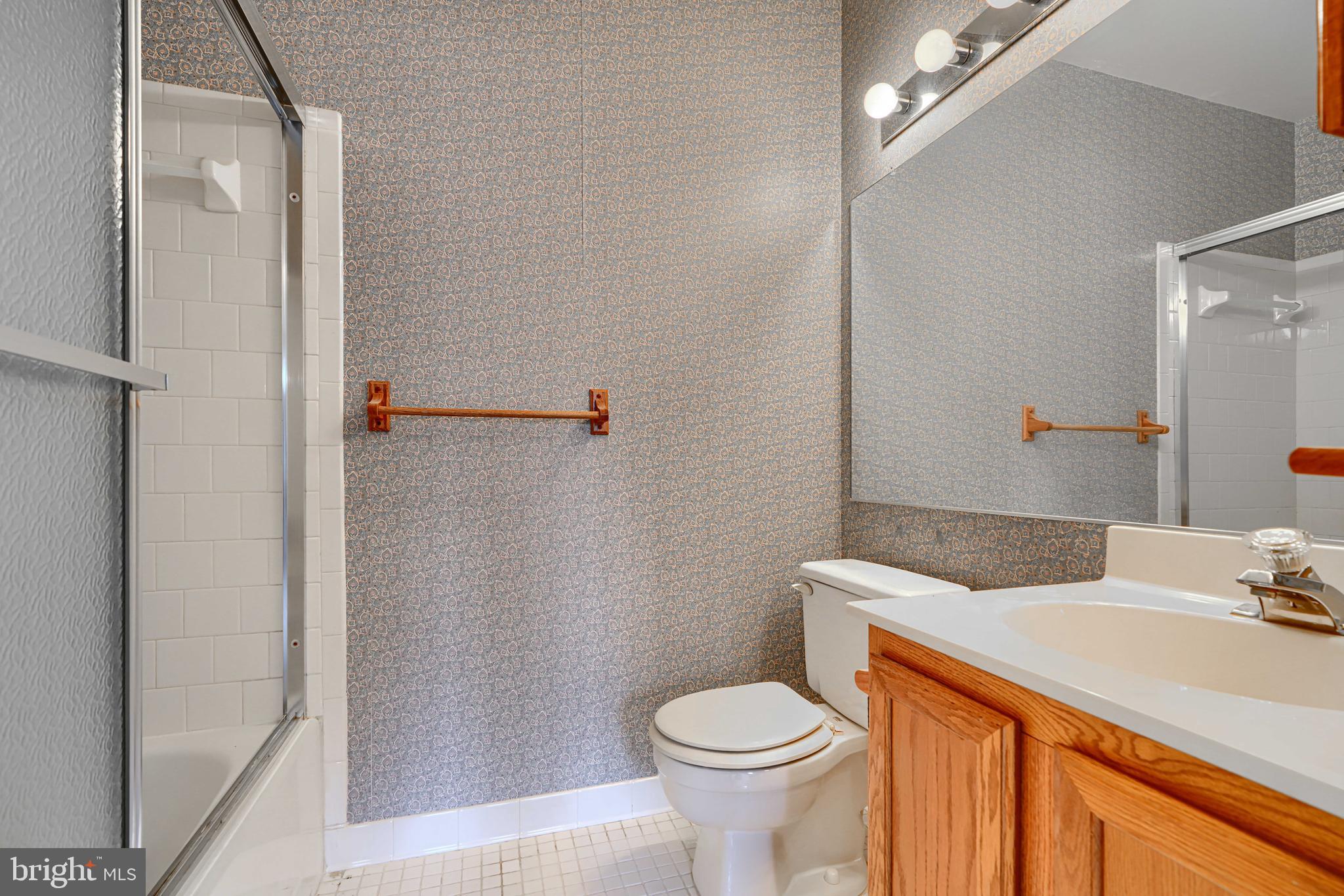 4 Juliet Lane, Unit 301 Baltimore, MD 21236 - Photo 18 of 29 a bathroom with a sink and a mirror