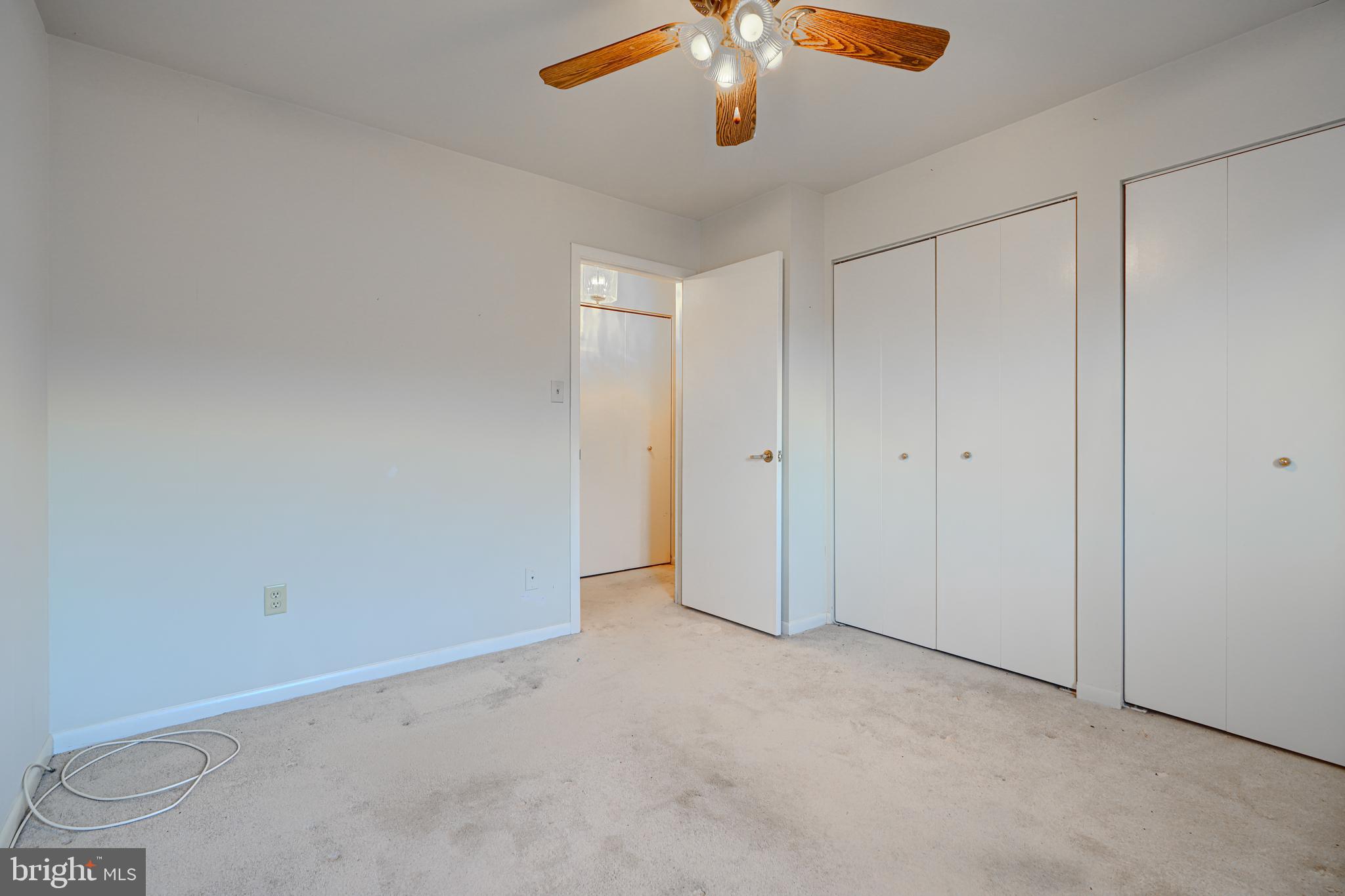 4 Juliet Lane, Unit 301 Baltimore, MD 21236 - Photo 21 of 29 an empty room with a chandelier fan