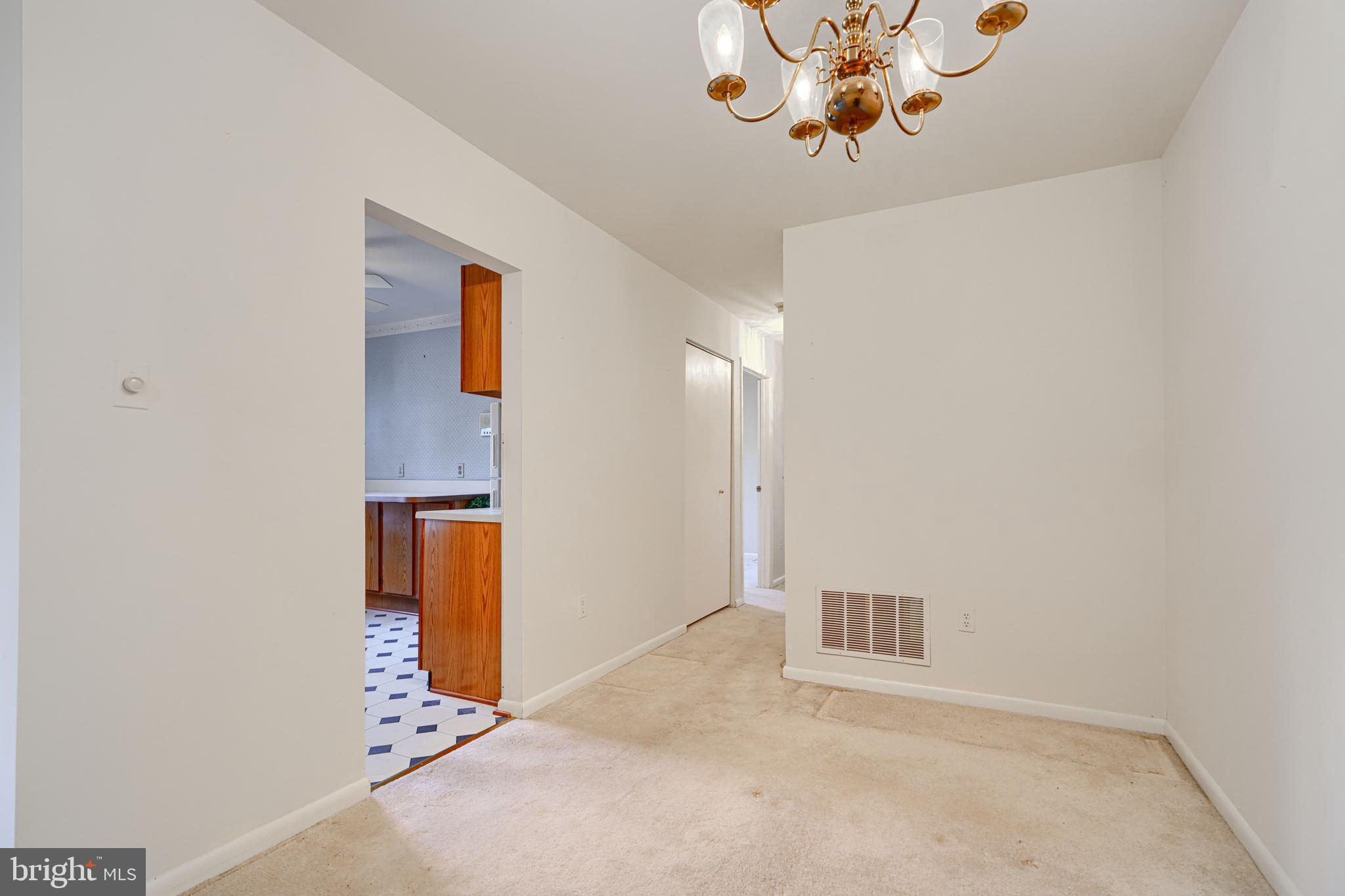 4 Juliet Lane, Unit 301 Baltimore, MD 21236 - Photo 8 of 29 an empty room with a chandelier fan