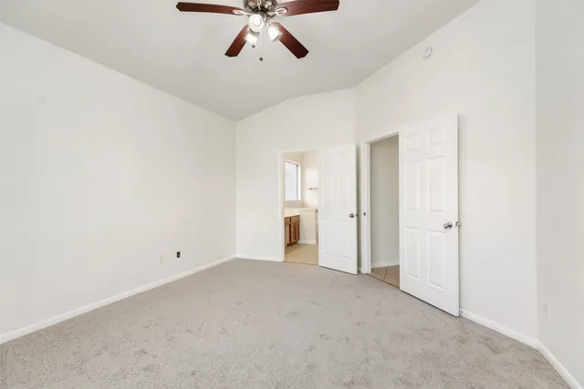 a spacious bathroom with a double vanity sink mirror and double