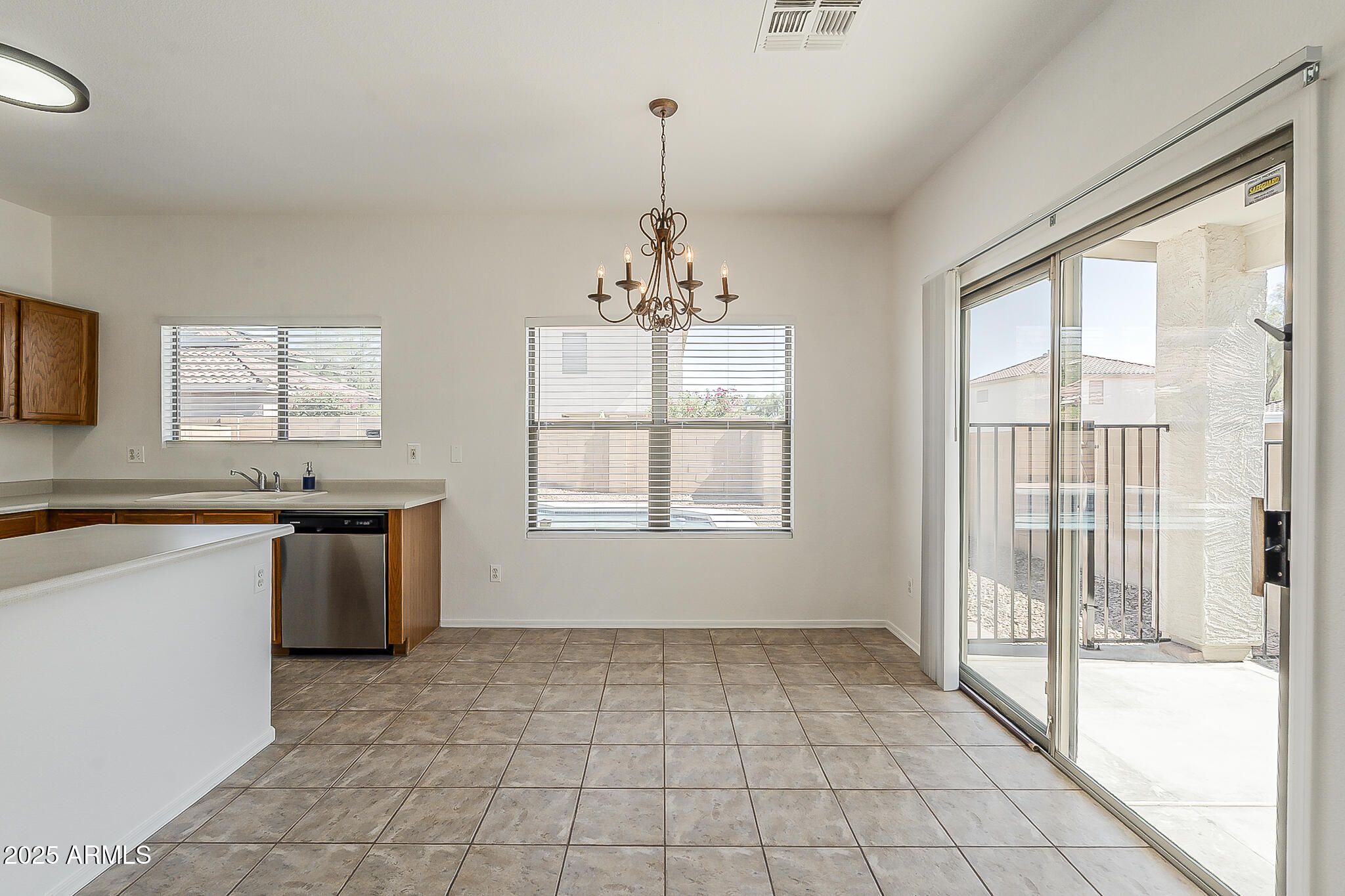 2286 East Peach Tree Drive Chandler, AZ 85249 - Photo 15 of 33 a kitchen with a stove a sink and a refrigerator