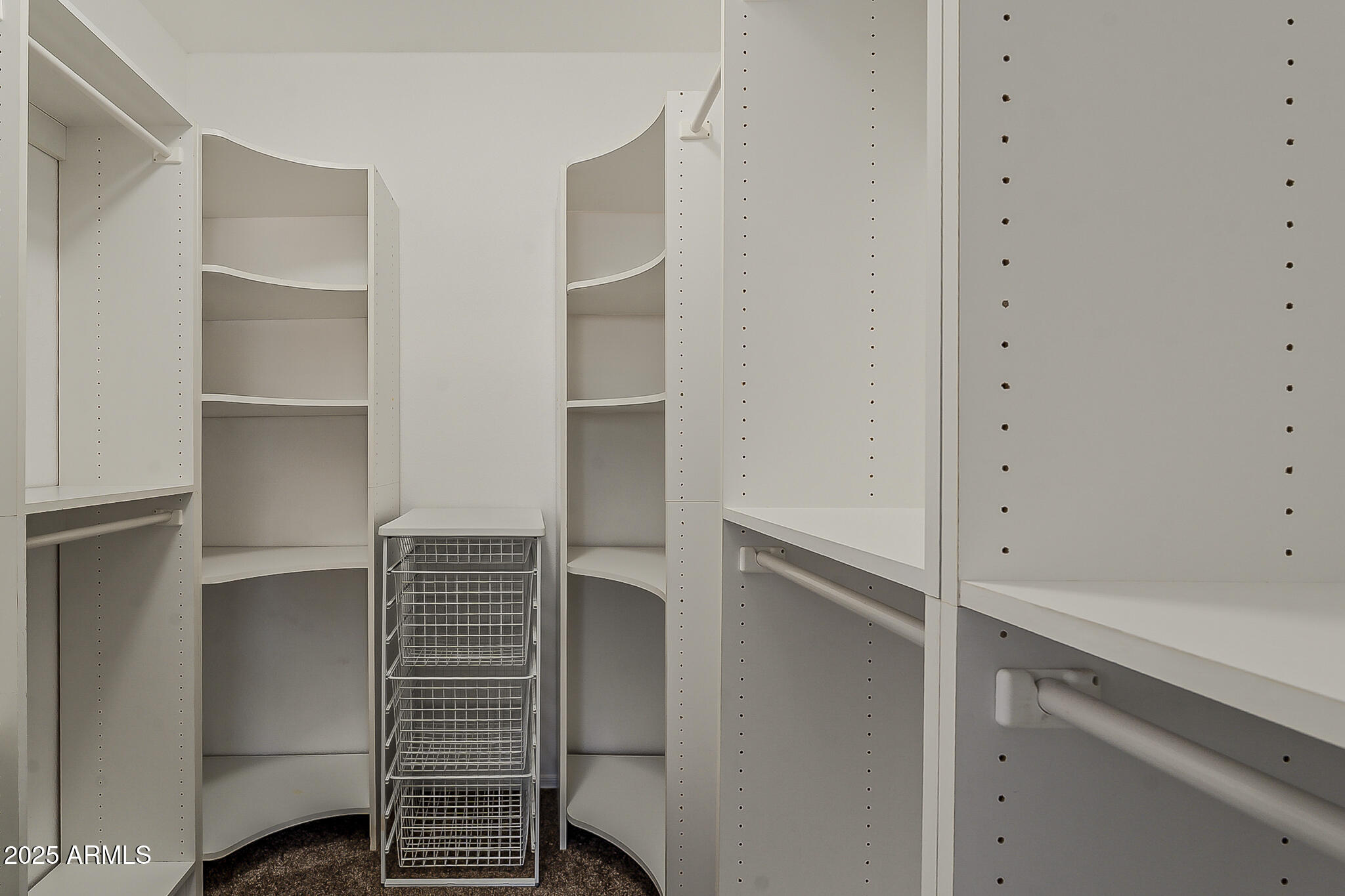 2286 East Peach Tree Drive Chandler, AZ 85249 - Photo 27 of 33 a view of walk in closet with empty racks