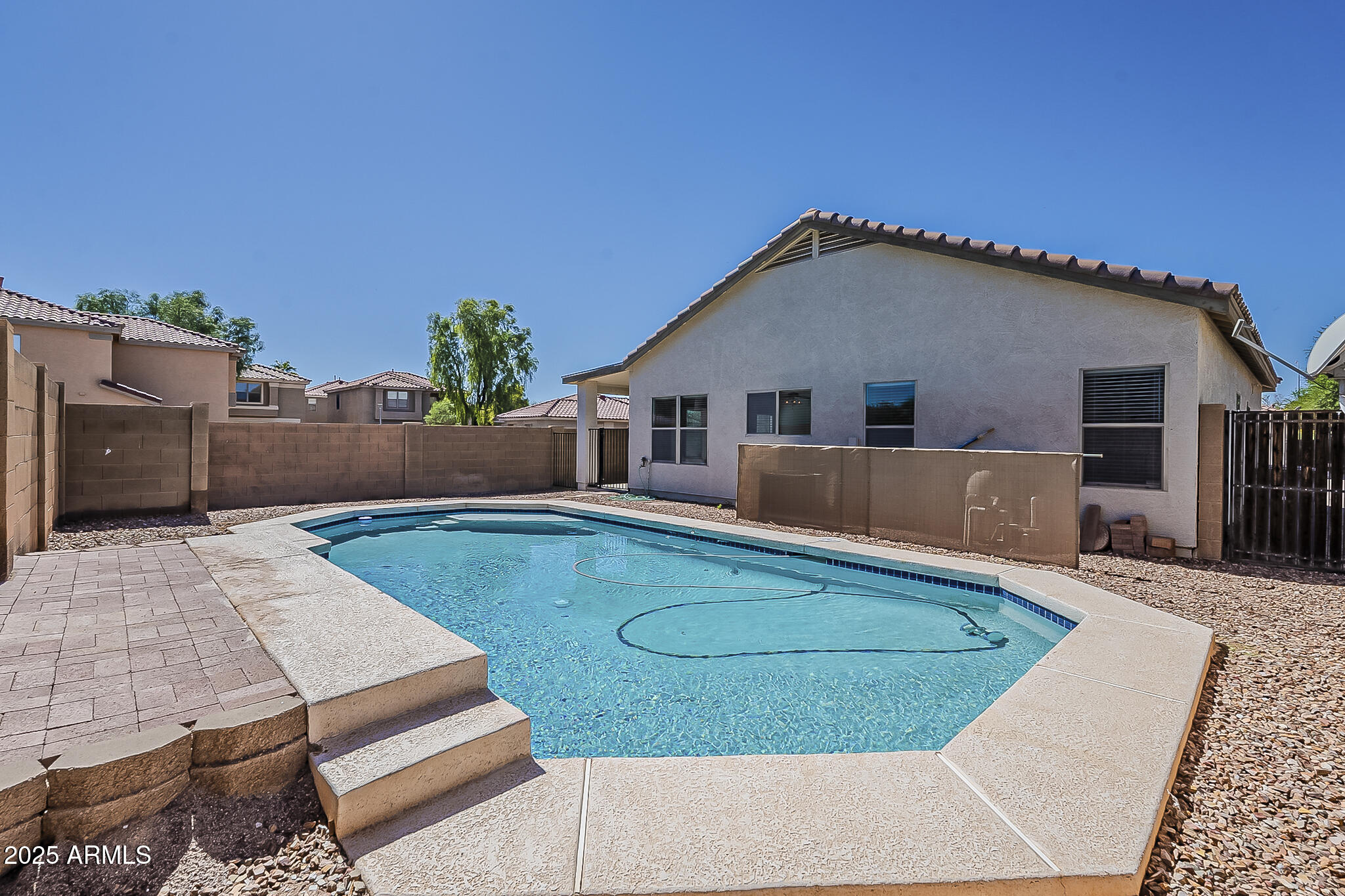 2286 East Peach Tree Drive Chandler, AZ 85249 - Photo 32 of 33 a view of a house with a backyard and a swimming pool