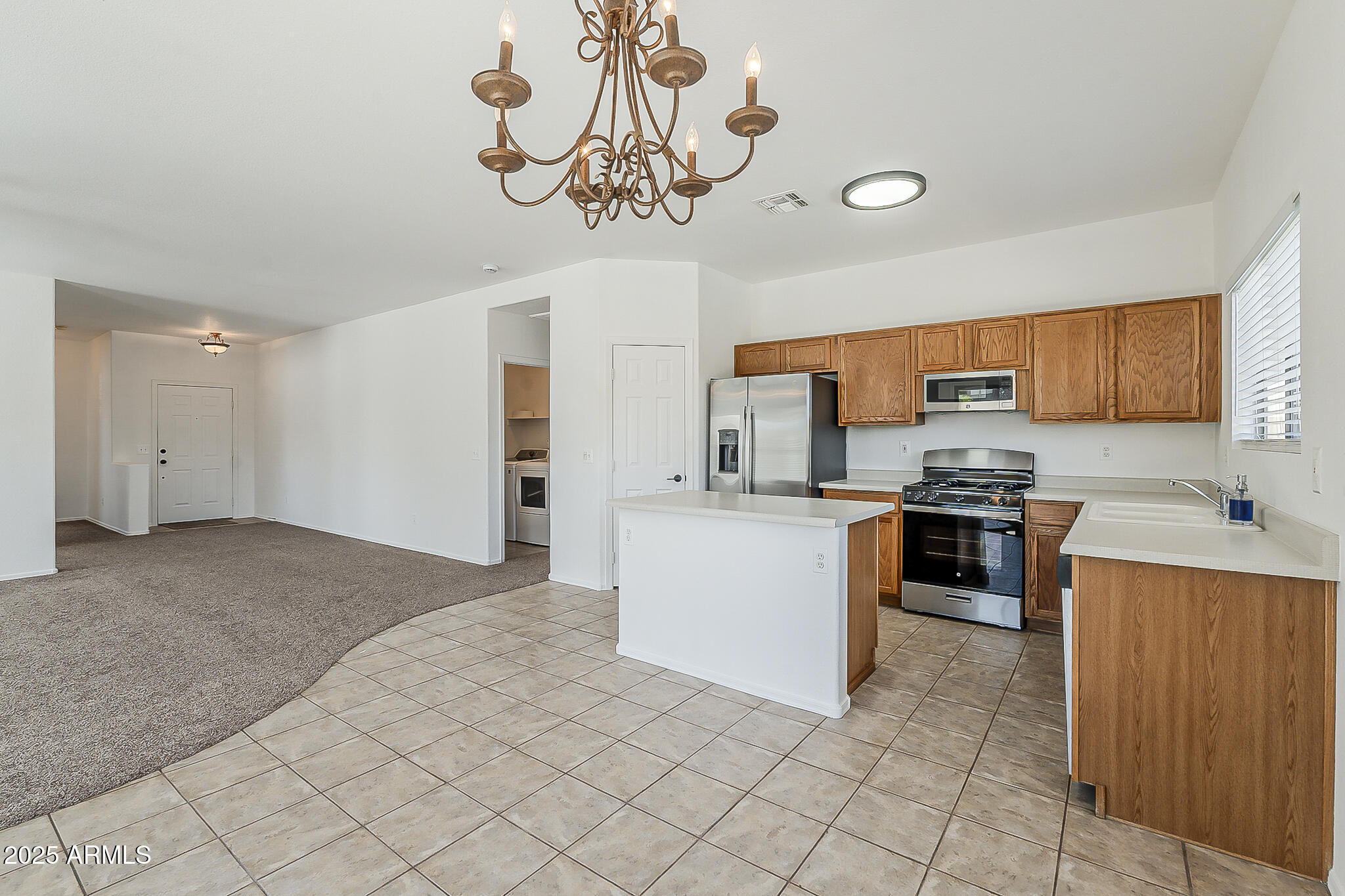 2286 East Peach Tree Drive Chandler, AZ 85249 - Photo 8 of 33 a kitchen with a refrigerator and cabinets