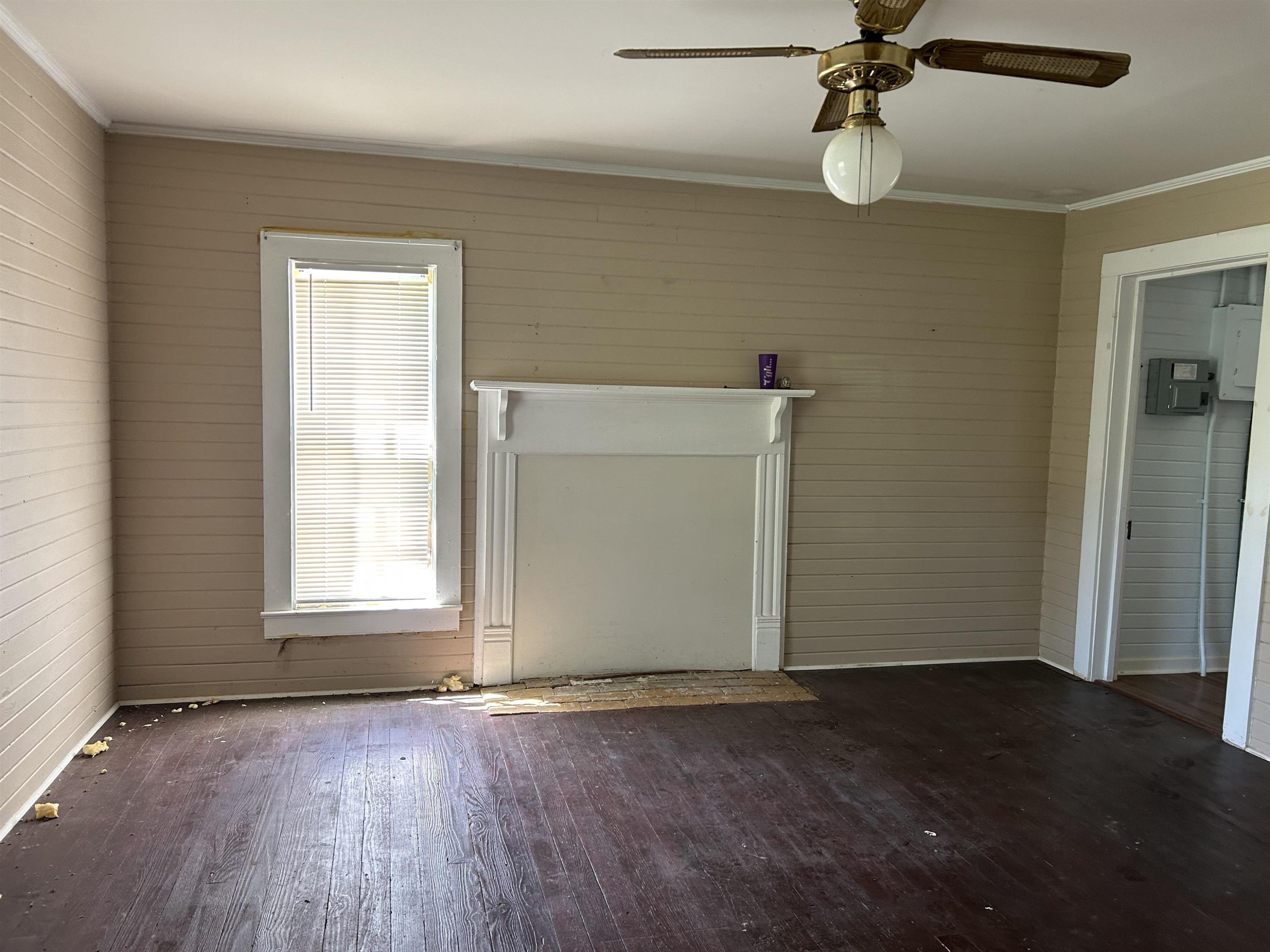 1414 Mason Road Durham, NC 27712 - Photo 8 of 16 an empty room with wooden floor closet and windows