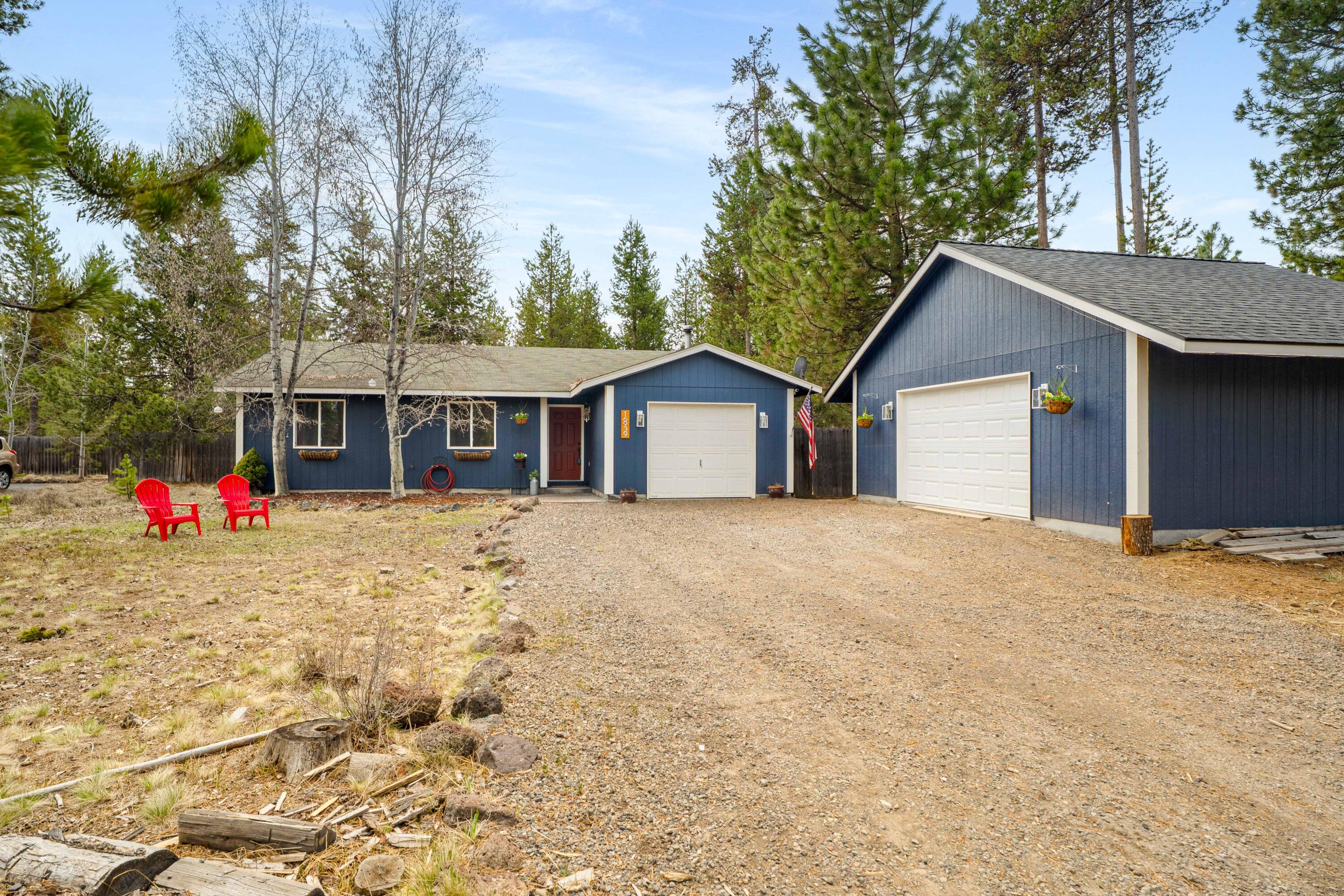 16939 Torrance Road Bend, OR 97707 - Photo 2 of 33 a view of a house with a yard and garage
