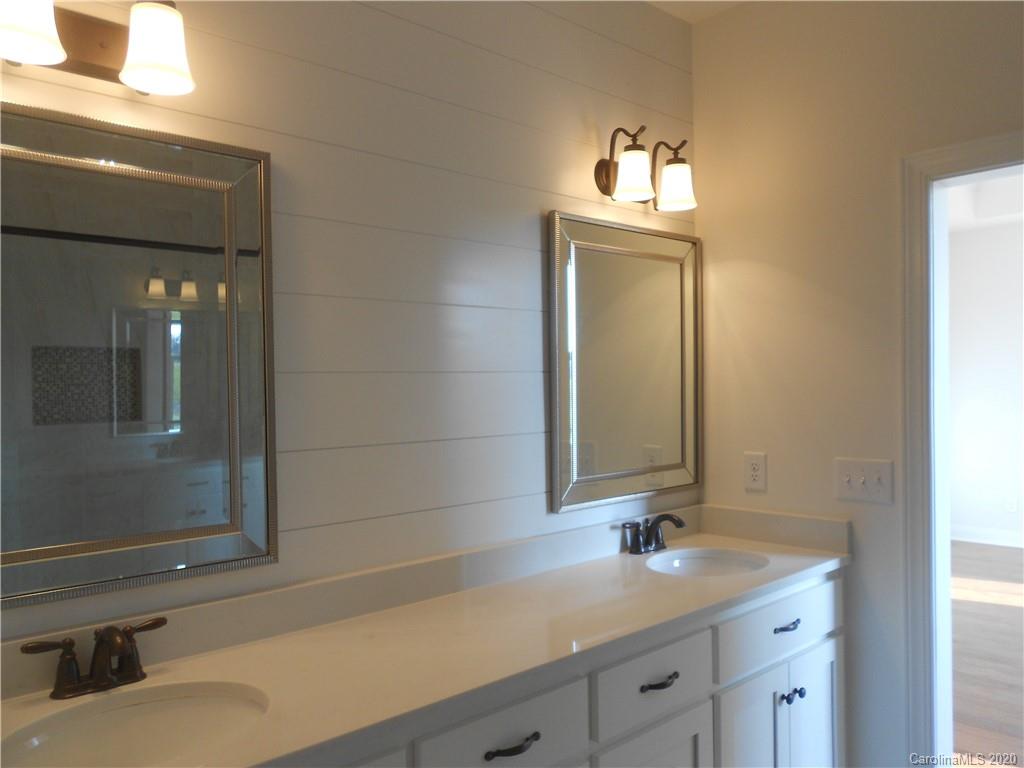 5606 Unionville-Brief Road Monroe, NC 28110 - Photo 16 of 21 a bathroom with a sink and a mirror