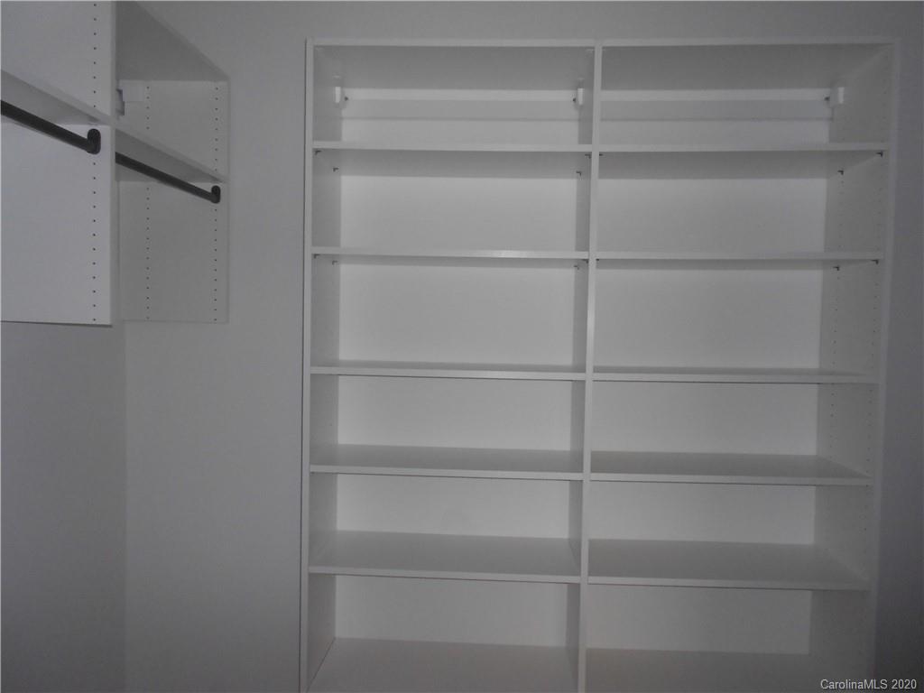 5606 Unionville-Brief Road Monroe, NC 28110 - Photo 17 of 21 a view of walk in closet with empty racks