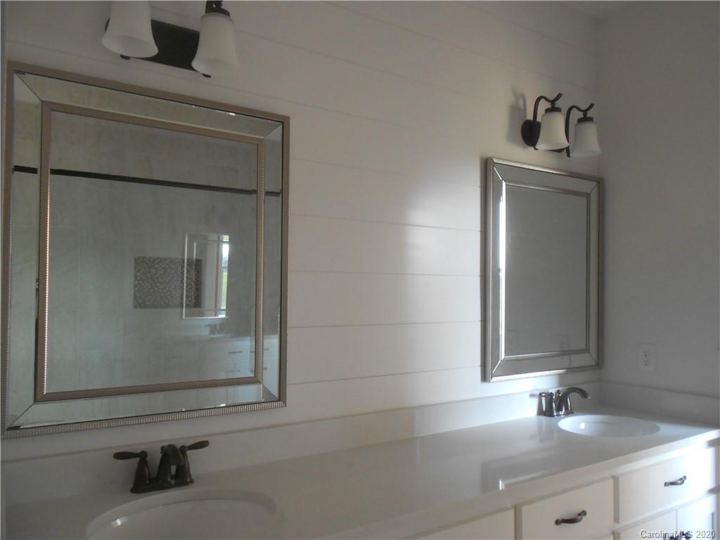 5606 Unionville-Brief Road Monroe, NC 28110 - Photo 20 of 21 a bathroom with a sink and a mirror