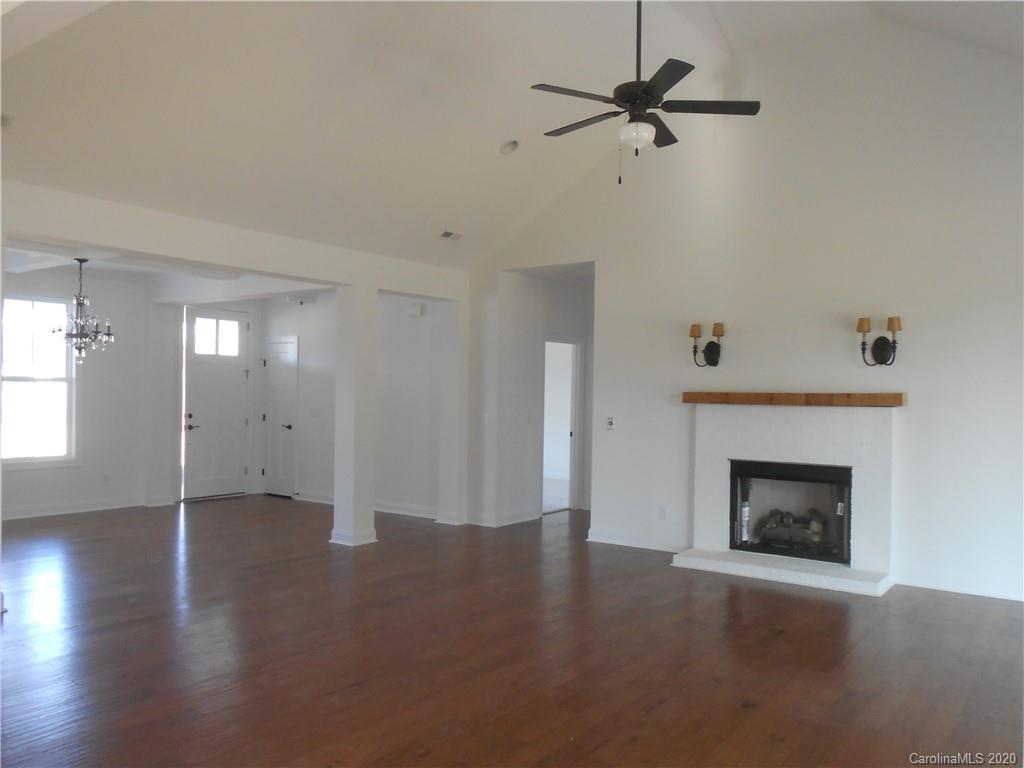 5606 Unionville-Brief Road Monroe, NC 28110 - Photo 3 of 21 an empty room with windows and fireplace