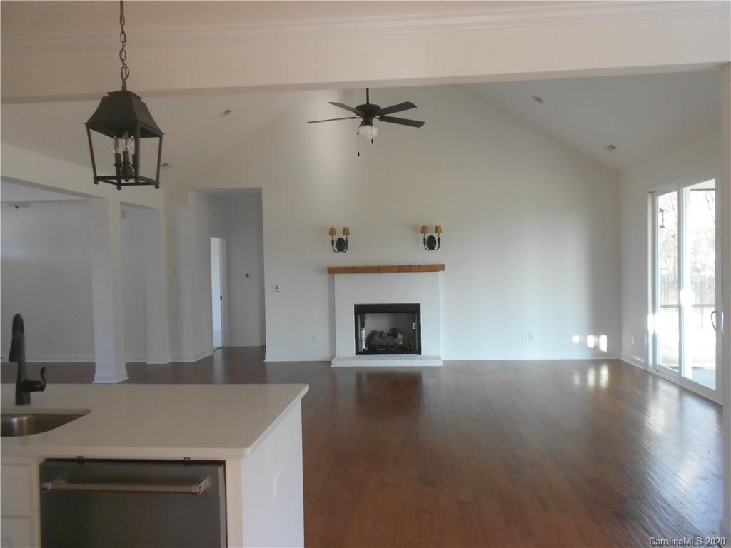 5606 Unionville-Brief Road Monroe, NC 28110 - Photo 5 of 21 a open kitchen with a sink and a fireplace