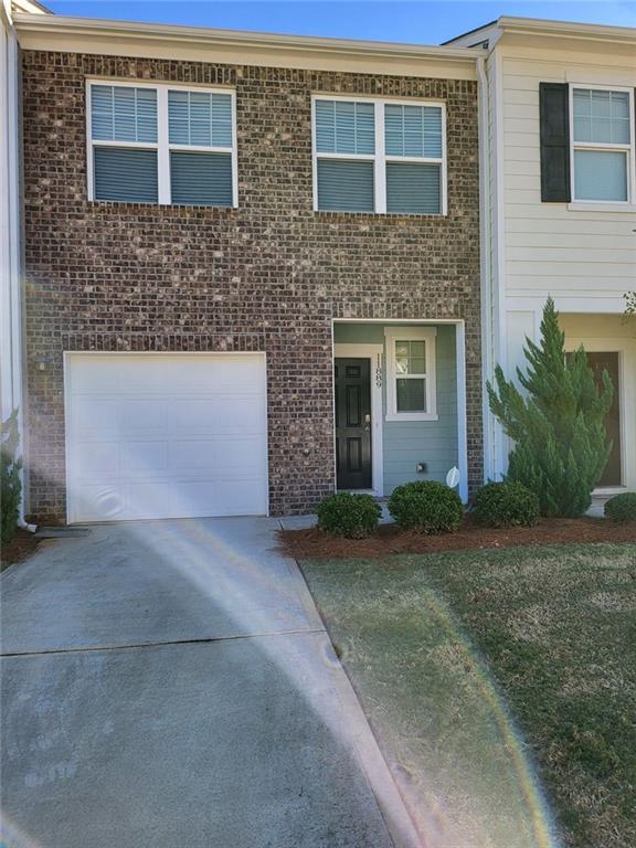 11889 Fuller Street Hampton, GA 30228 - Photo 2 of 2 a front view of a house with yard