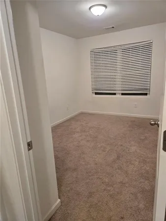 en view of an empty room with a window