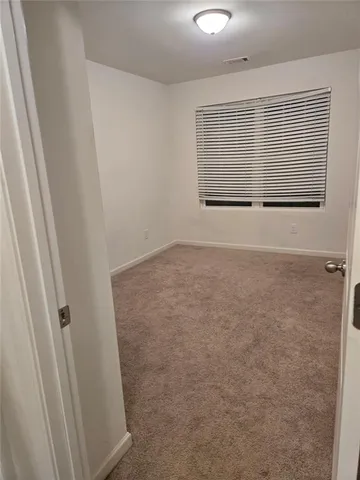 en view of an empty room with a window