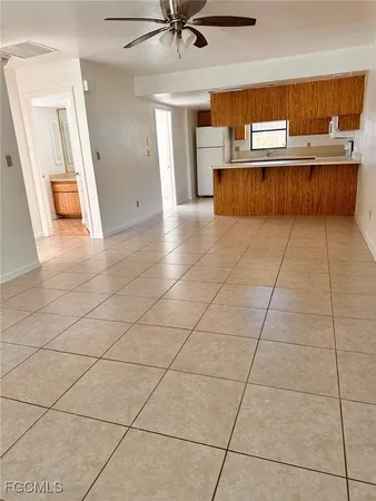 a view of kitchen with furniture and window