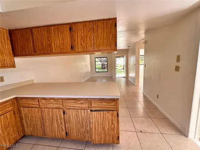a view of a utility room with cabinets