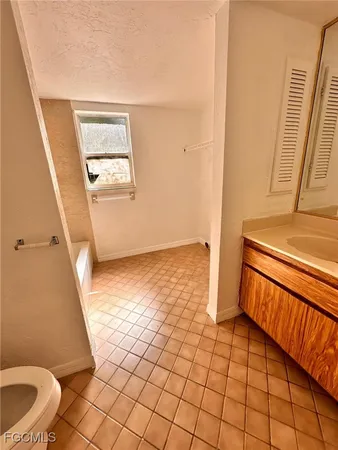 a view of an empty room and a window