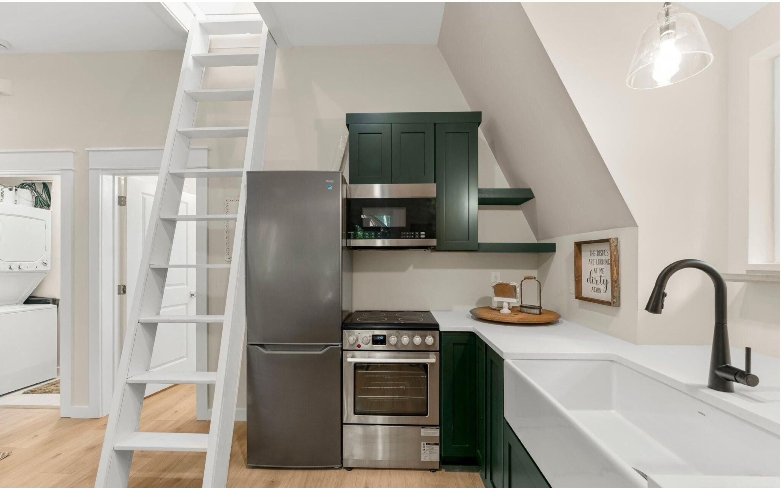 493 Choctawhatchee River Road Ponce de Leon, FL 32455 - Photo 12 of 35 a kitchen with stainless steel appliances a stove a sink and a refrigerator