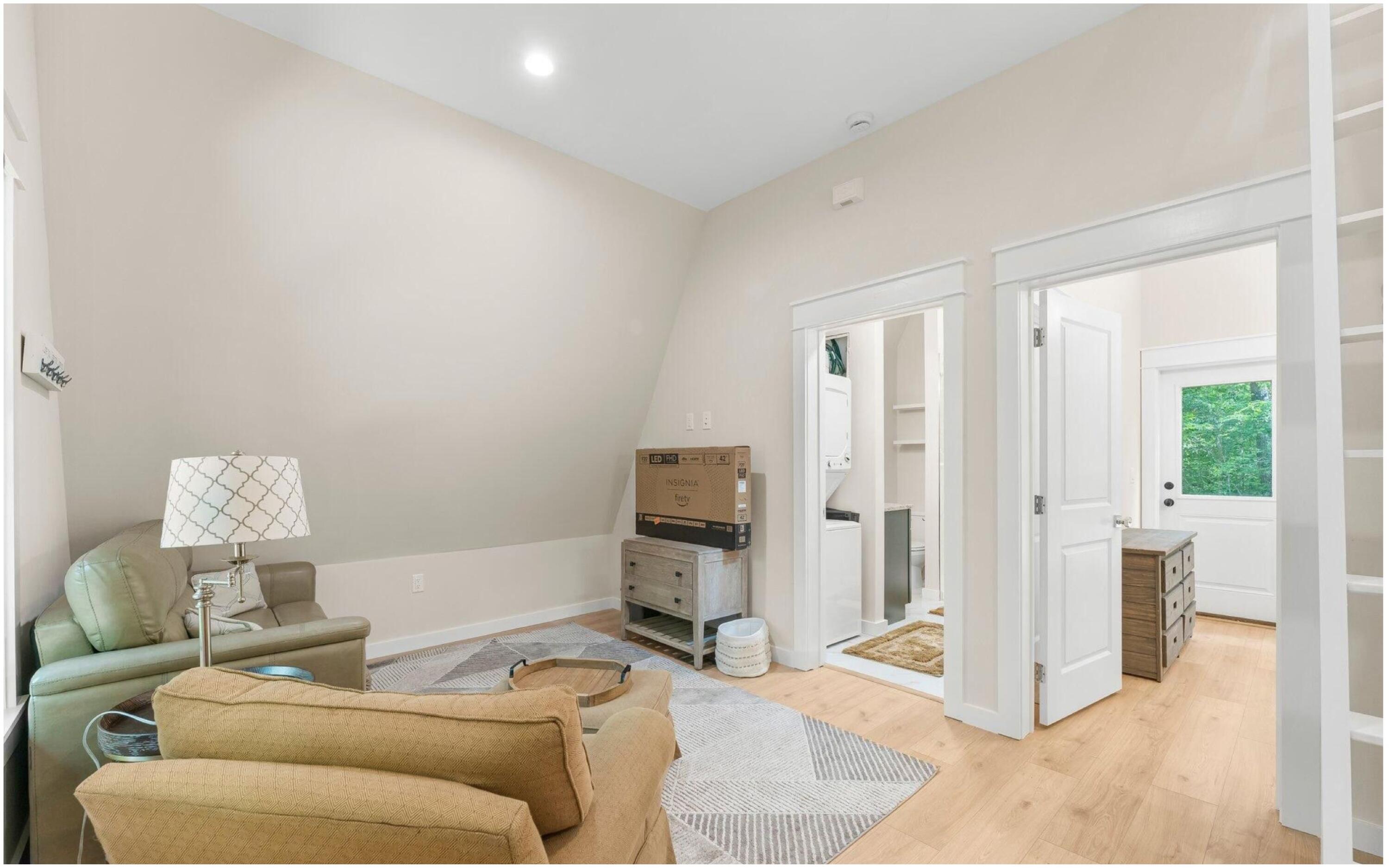 493 Choctawhatchee River Road Ponce de Leon, FL 32455 - Photo 15 of 35 a living room with furniture and a flat screen tv