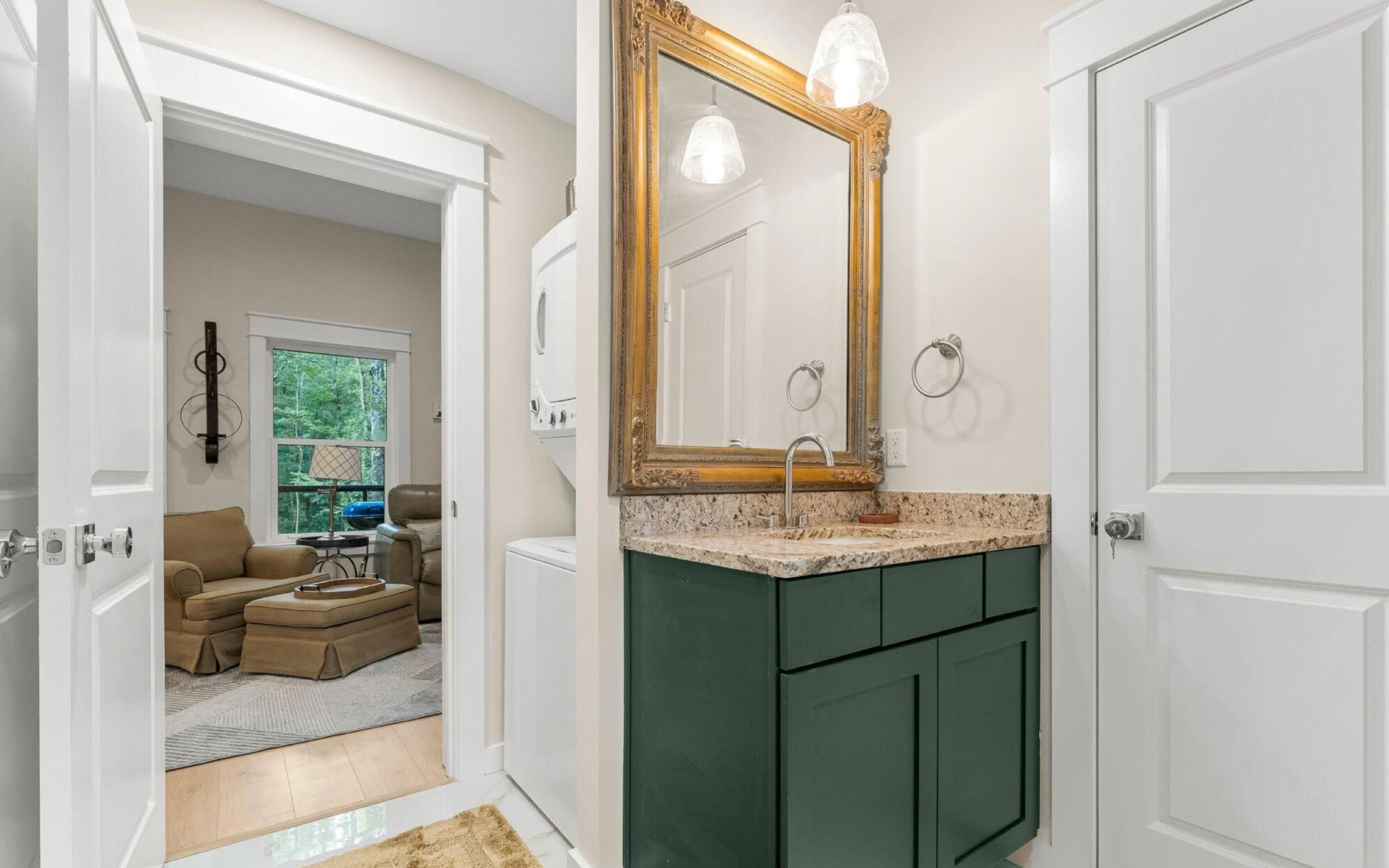 493 Choctawhatchee River Road Ponce de Leon, FL 32455 - Photo 17 of 35 a en suite bathroom with a granite countertop sink and a mirror