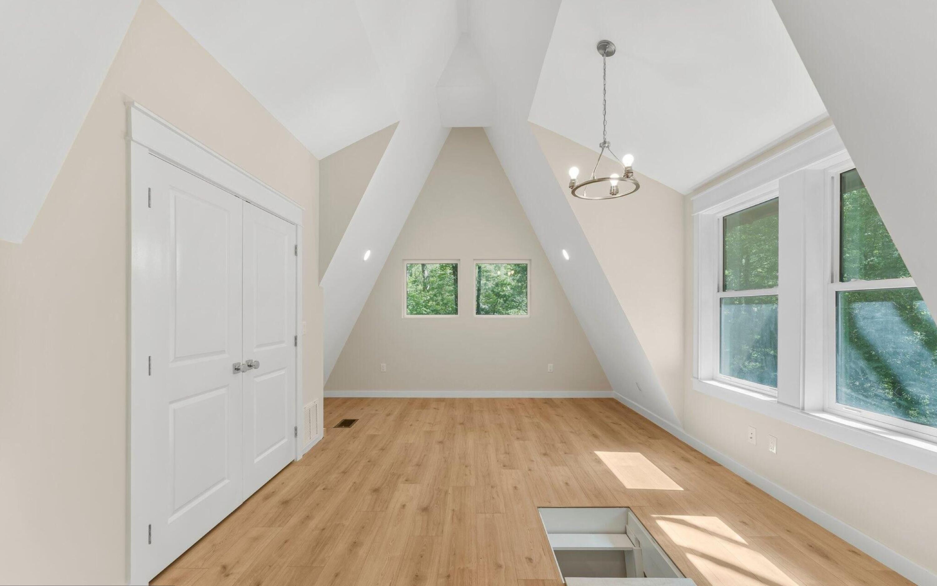 493 Choctawhatchee River Road Ponce de Leon, FL 32455 - Photo 20 of 35 wooden floor in an empty room with a window