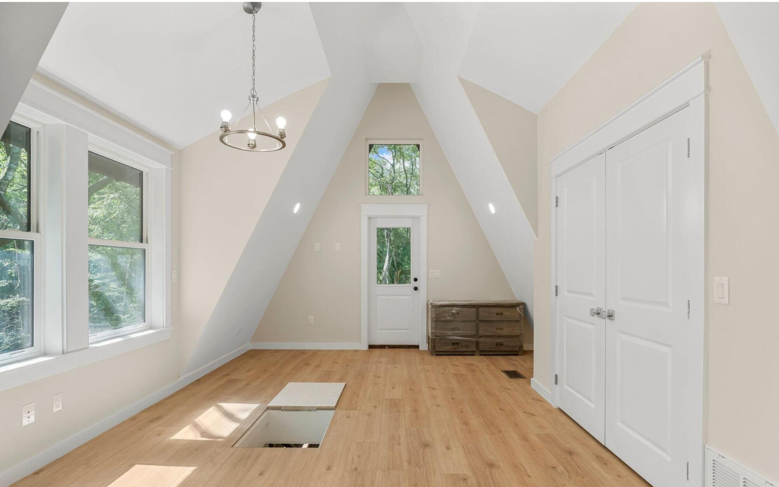 493 Choctawhatchee River Road Ponce de Leon, FL 32455 - Photo 22 of 35 a view of a hallway with wooden floor and staircase