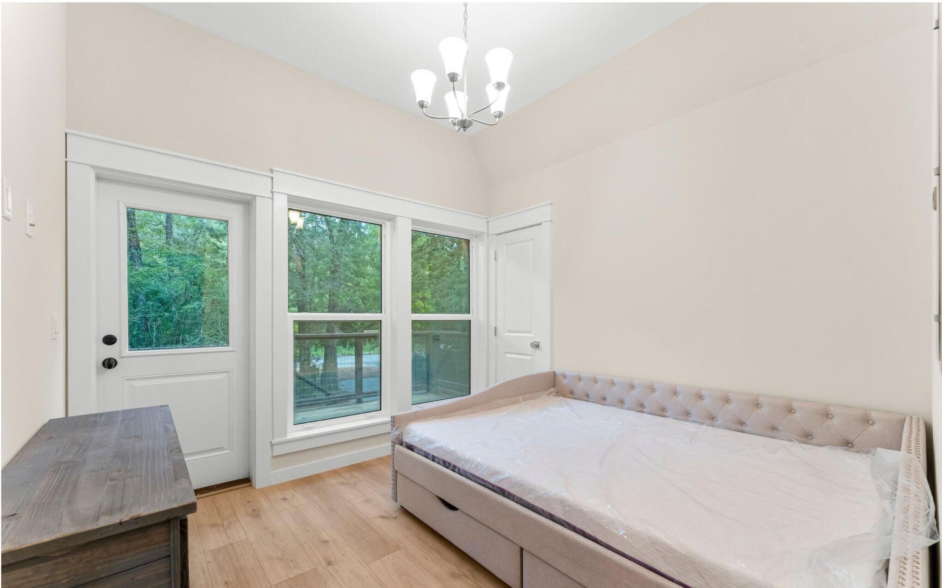 493 Choctawhatchee River Road Ponce de Leon, FL 32455 - Photo 9 of 35 a bedroom with a bed and window