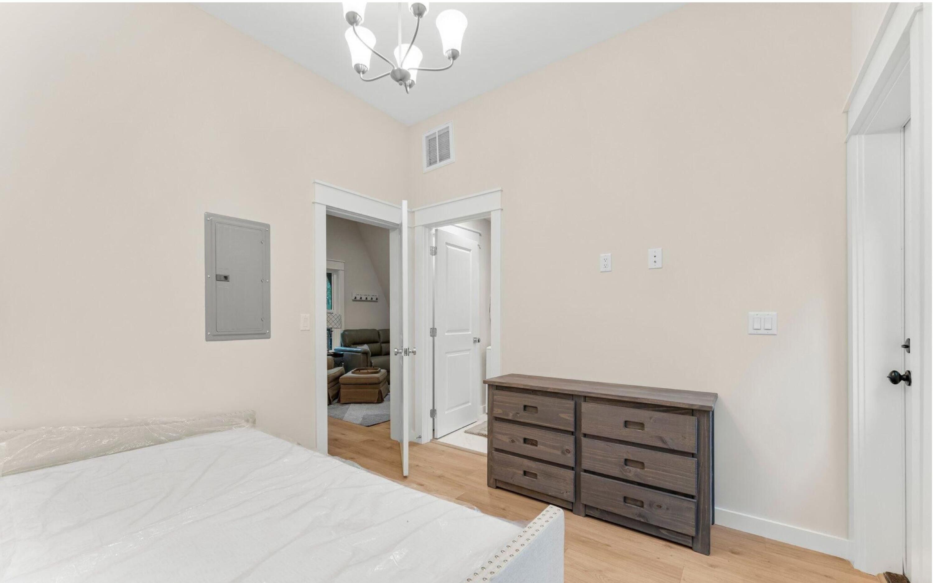 493 Choctawhatchee River Road Ponce de Leon, FL 32455 - Photo 10 of 35 a bedroom with a bed and a dresser