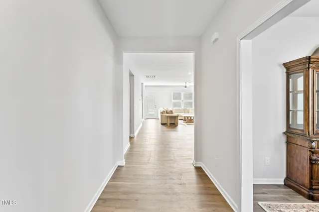 a view of a living room with a wooden floor