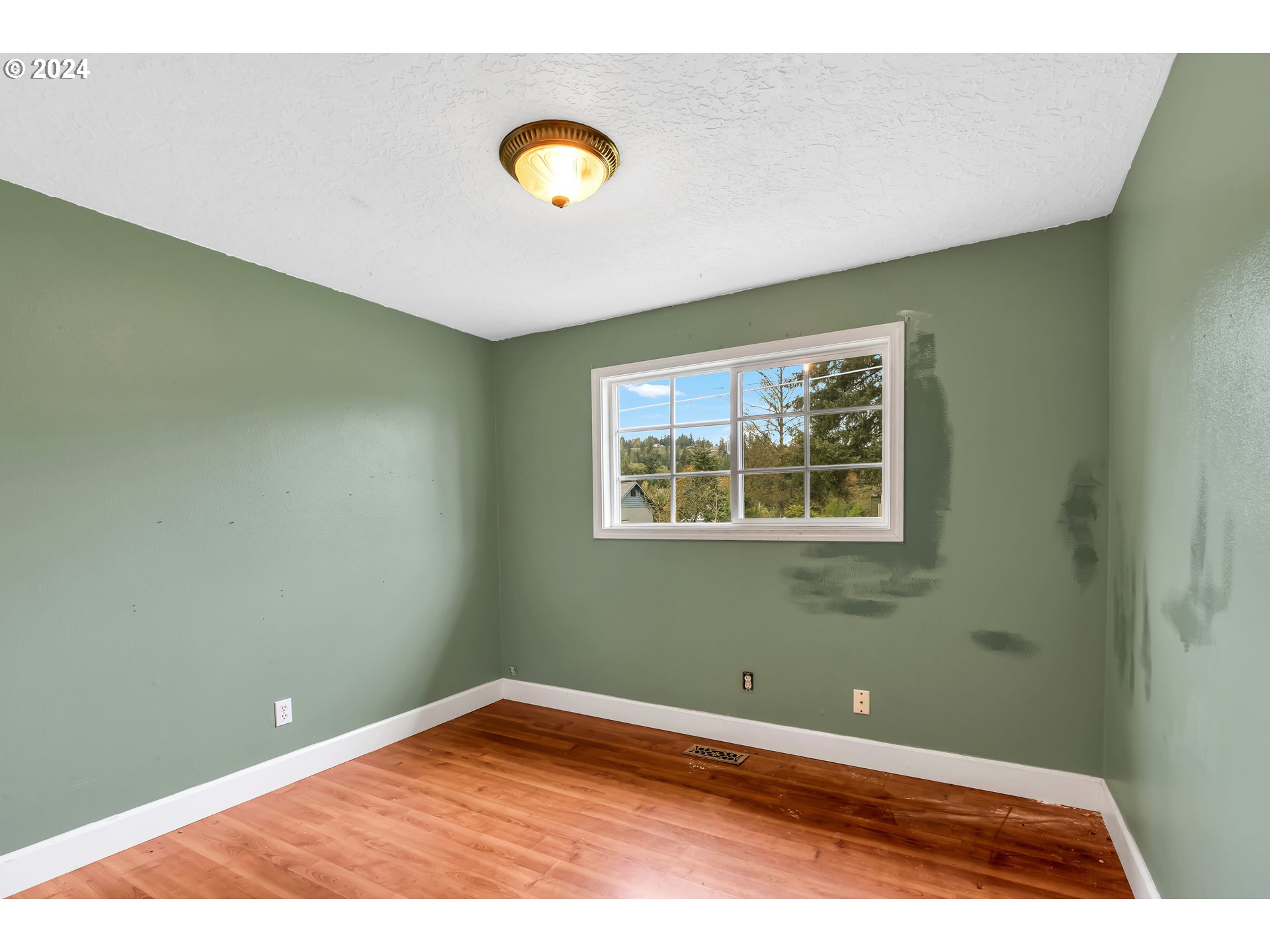 822 Olson Road Longview, WA 98632 - Photo 15 of 27 a view of empty room with wooden floor