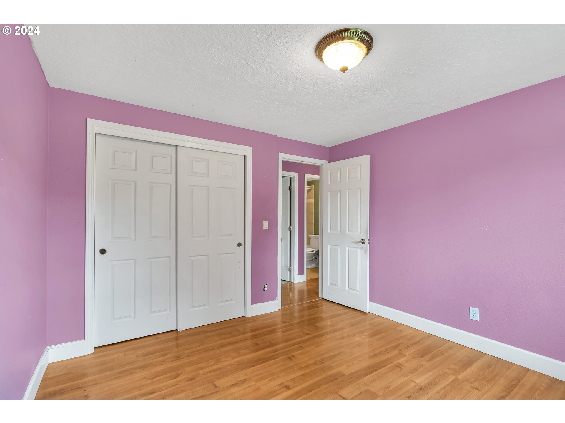 822 Olson Road Longview, WA 98632 - Photo 18 of 27 a view of an empty room with window and wooden floor