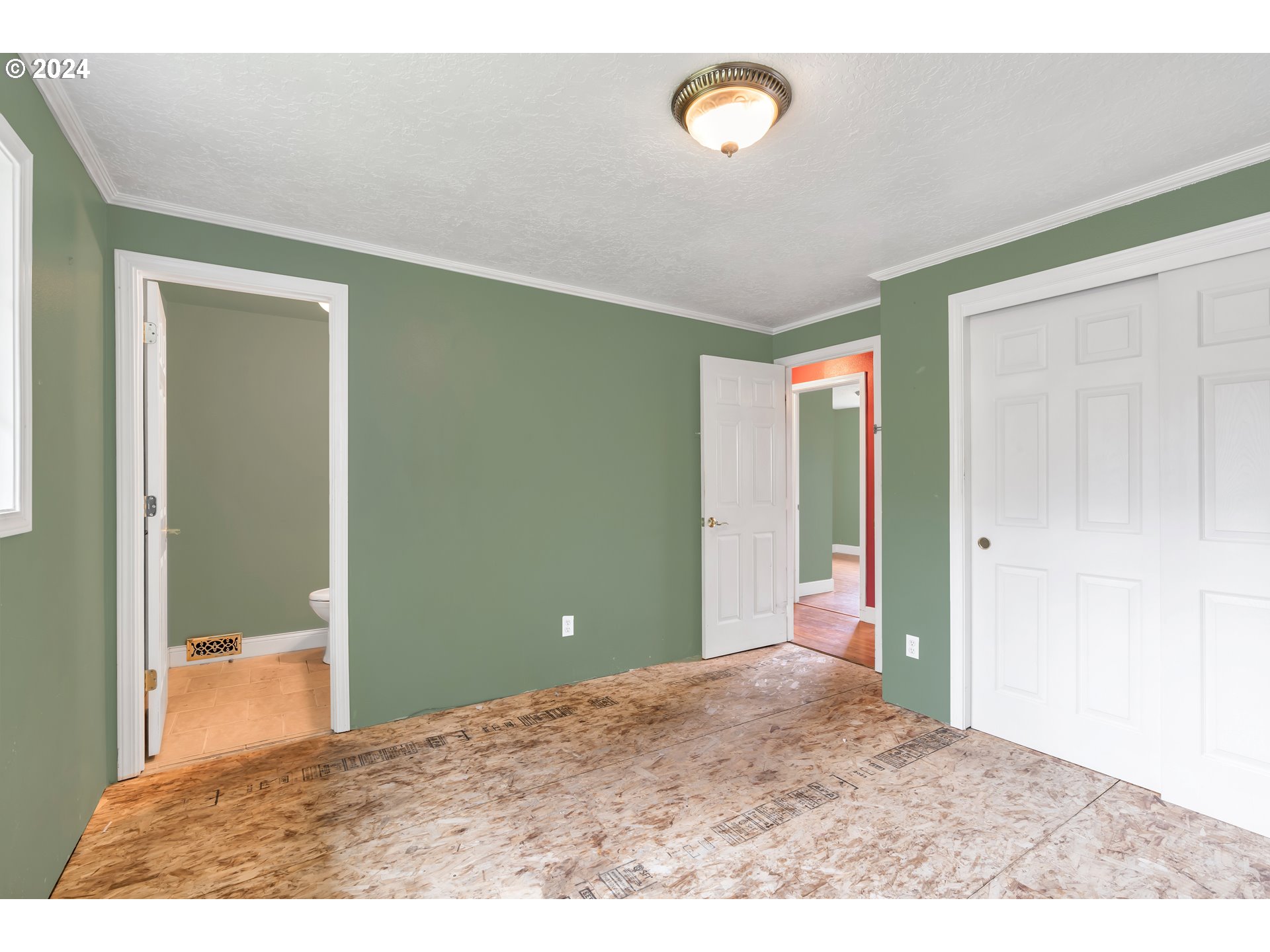822 Olson Road Longview, WA 98632 - Photo 20 of 27 a view of a big room with closet and wooden floor