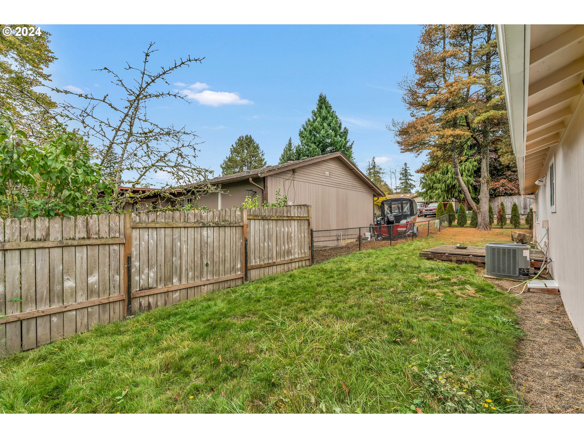 822 Olson Road Longview, WA 98632 - Photo 25 of 27 a view of backyard with small garden and wooden fence