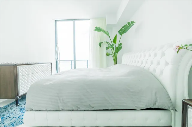 a close up of a potted plant sitting on a bed