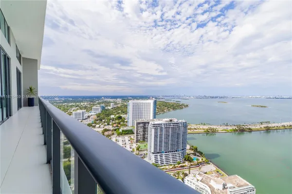 a view of a balcony with an ocean view