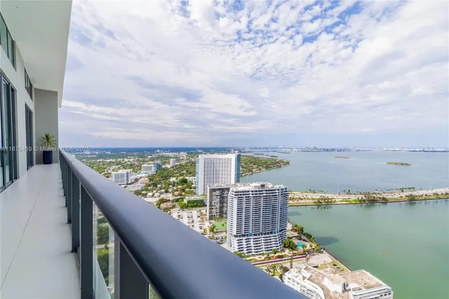 a view of a balcony with an ocean view