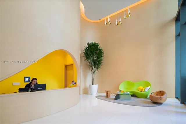 a bathroom with a sink and mirror with bathtub