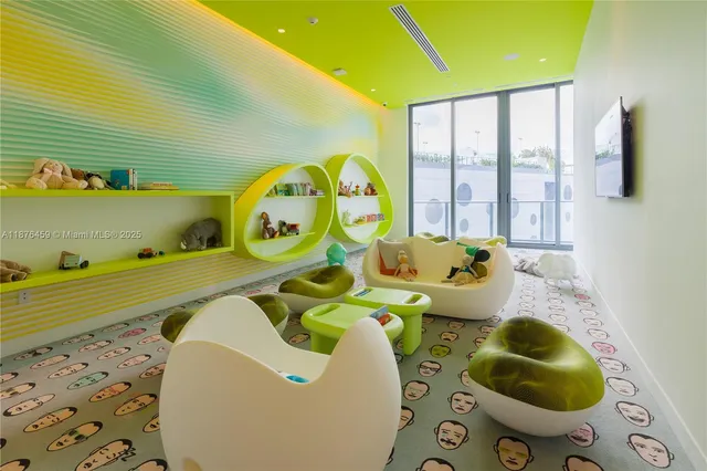 a bed sitting in a bedroom next to a large window