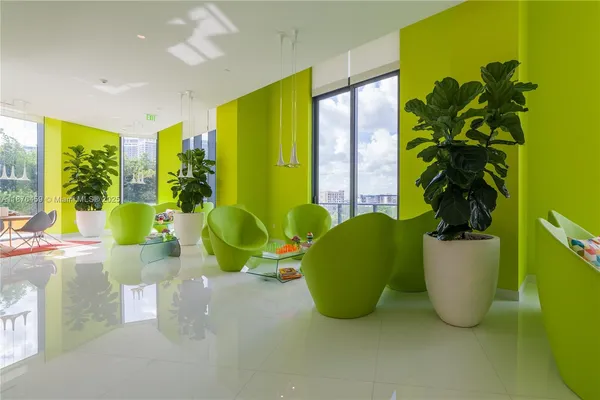 a living room with couches and painted walls