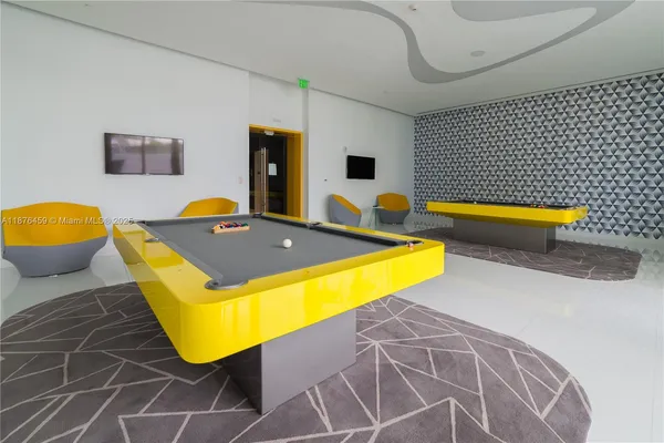 a view of a lobby with furniture and floor to ceiling window