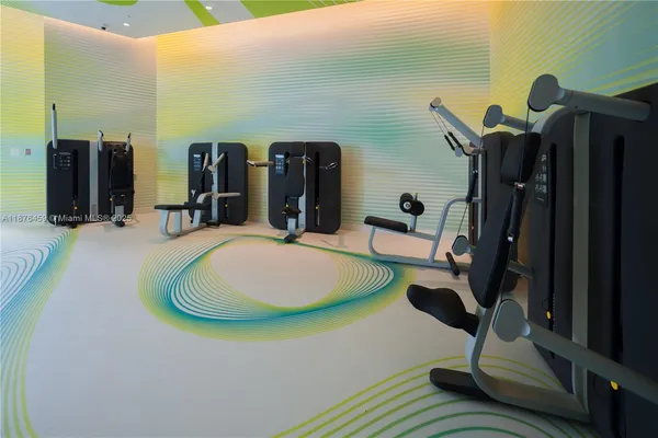 a en suite bathroom with a granite countertop sink and a mirror
