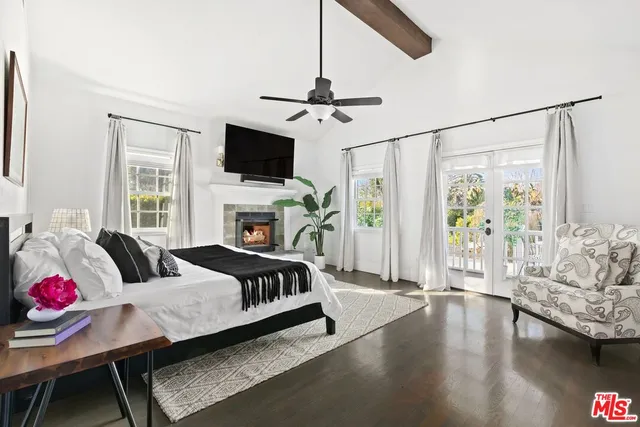 a living room with furniture fireplace and flat screen tv
