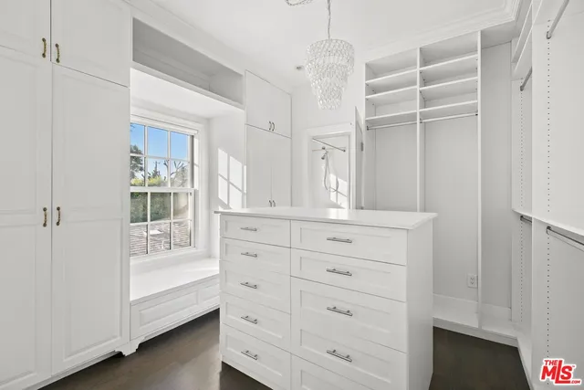 a spacious bathroom with a double vanity sink and a mirror