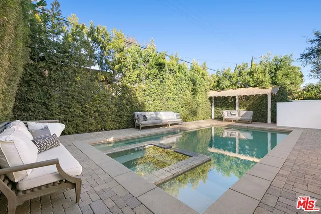 a view of a swimming pool with a patio