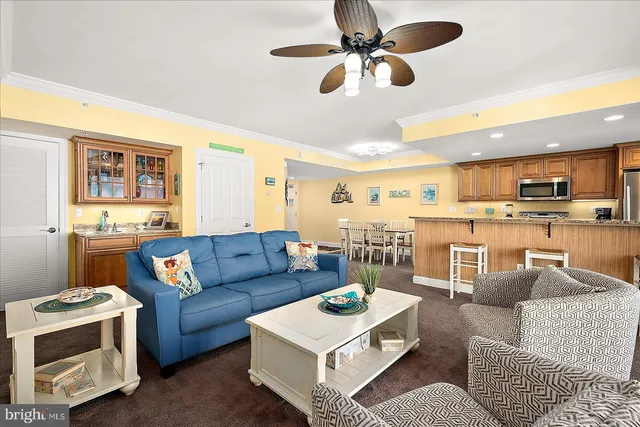 a kitchen with stainless steel appliances granite countertop a stove microwave and refrigerator