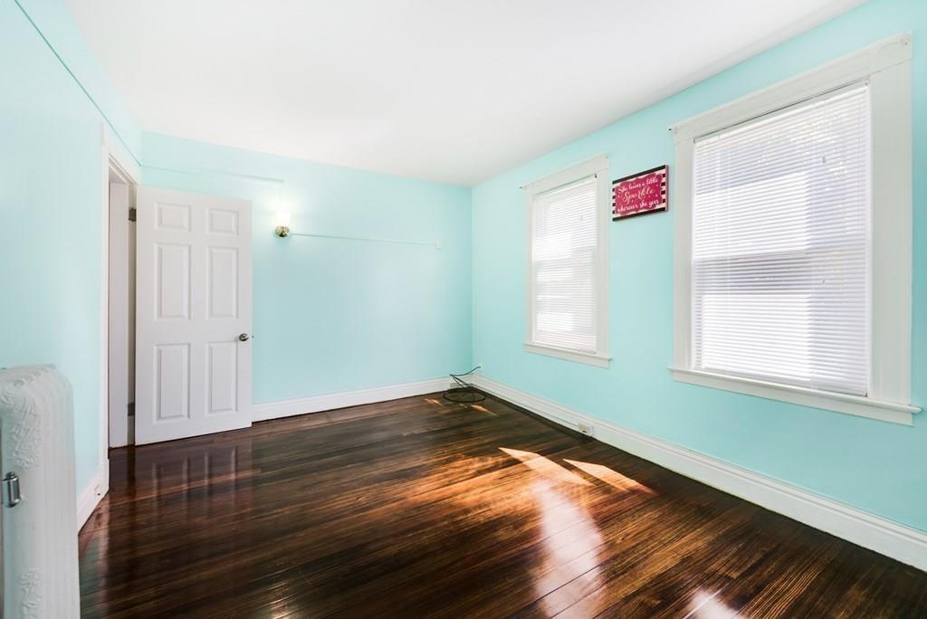 35 Trillium Street Springfield, MA 01108 - Photo 25 of 39 a view of an empty room with wooden floor and a window